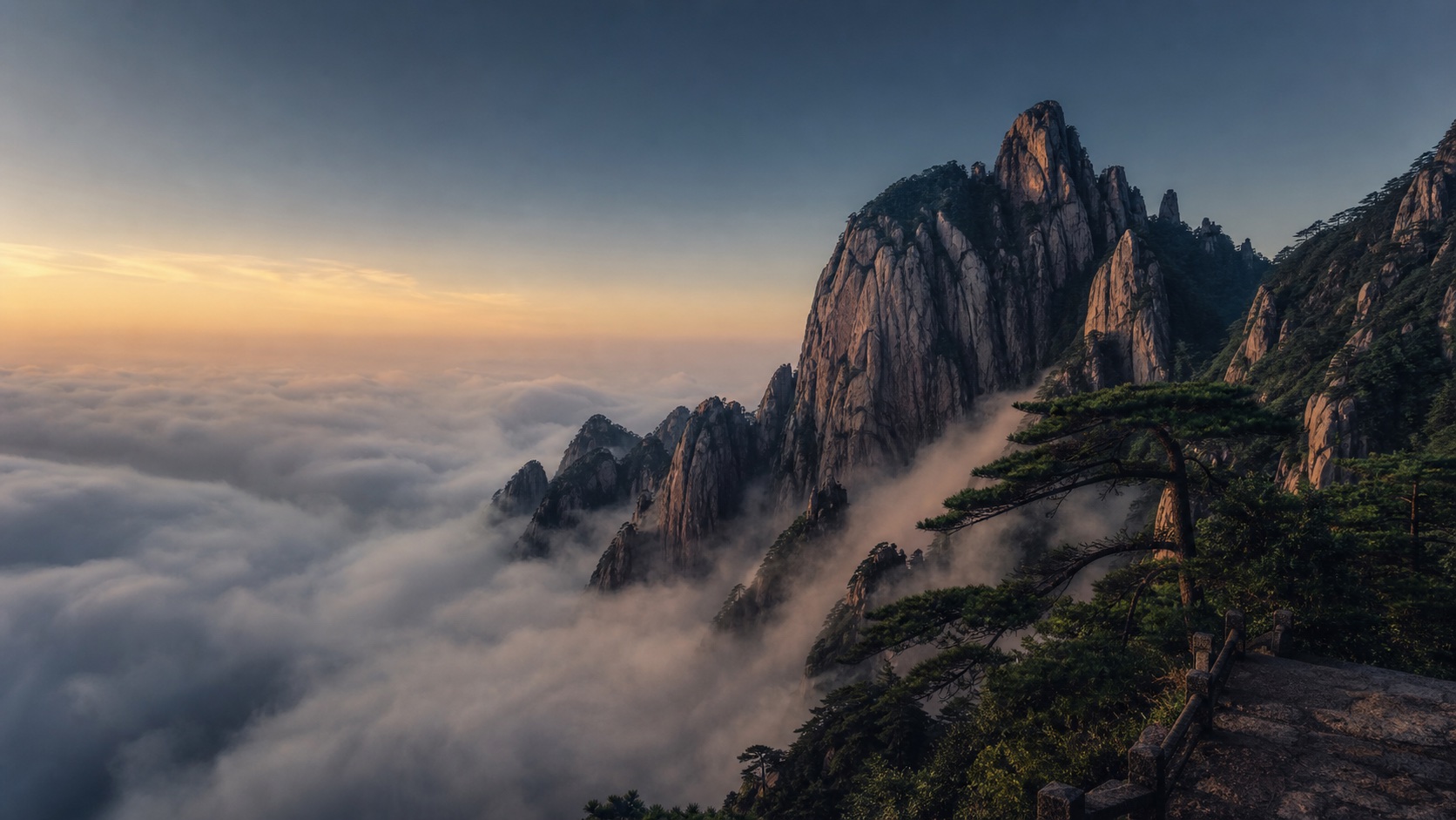 清晨云海中的黄山群峰与松树